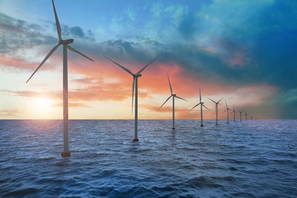 Image showing floating wind turbines installed at sea.
