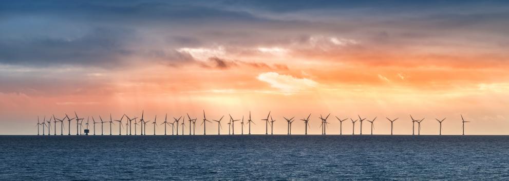 Image showing wind energy with modern windmills at sunset.