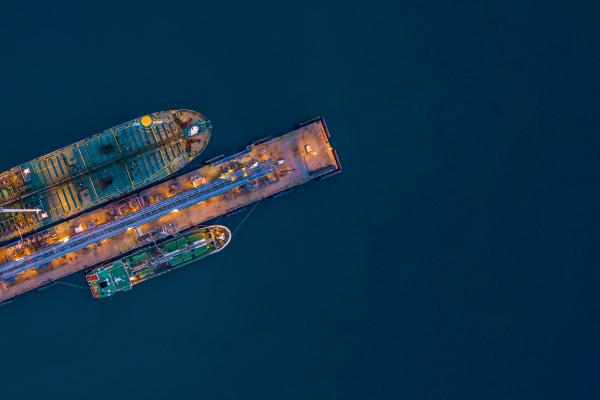 Ariel view tanker ship loading in port at night, 