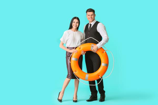 Woman and man holding an orange buoy